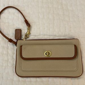 Coach wristlet- beige canvas type fabric with tan leather trim